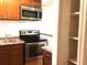 Kitchen featuring modern stainless steel appliances and granite countertops at 2625 State Road 590 # 1822, Clearwater, FL 33759