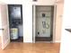 Utility closet featuring the hot water heater and a storage closet with shelving at 2625 State Road 590 # 1822, Clearwater, FL 33759