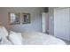 Cozy bedroom featuring neutral tones, a comfortable bed, and ample closet space at 2990 Eagle Estates W Cir, Clearwater, FL 33761