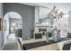 Elegant dining room with chandelier, archways, and fireplace at 2990 Eagle Estates W Cir, Clearwater, FL 33761