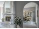 Dining room showcasing a marble fireplace and a view of the formal dining area at 2990 Eagle Estates W Cir, Clearwater, FL 33761