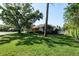 Lovely single-story home with mature trees and manicured lawns in a quiet neighborhood at 2990 Eagle Estates W Cir, Clearwater, FL 33761