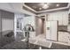 Stylish kitchen with granite countertops, stainless steel appliances, and seamless transition to living area at 2990 Eagle Estates W Cir, Clearwater, FL 33761