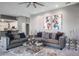 Open-concept living room featuring modern decor, comfortable sofas, and seamless access to the kitchen at 2990 Eagle Estates W Cir, Clearwater, FL 33761