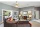 Elegant living room with neutral tones, French doors, and stylish decor at 2990 Eagle Estates W Cir, Clearwater, FL 33761
