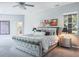 Spacious main bedroom with plush carpeting, sitting area, and ensuite bathroom at 2990 Eagle Estates W Cir, Clearwater, FL 33761