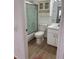 Bathroom with shower, toilet, tile floors, and vanity with storage at 29931 Playa Del Rey Ln, Wesley Chapel, FL 33543