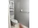 Bathroom featuring a toilet, vanity, and cabinet above toilet at 29931 Playa Del Rey Ln, Wesley Chapel, FL 33543