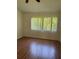 Bedroom with window and hardwood floors at 29931 Playa Del Rey Ln, Wesley Chapel, FL 33543