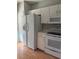 Kitchen featuring white appliances and ample storage cabinets at 29931 Playa Del Rey Ln, Wesley Chapel, FL 33543