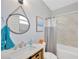 Updated bathroom with modern vanity, neutral color scheme, and tub with shower at 3002 E 24Th Ave, Tampa, FL 33605