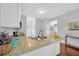Spacious kitchen island featuring granite countertops and ample counter space at 3002 E 24Th Ave, Tampa, FL 33605