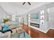 Open-concept living room with modern fireplace, hardwood floors, and recessed lighting at 3002 E 24Th Ave, Tampa, FL 33605