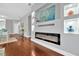 Living room with modern fireplace, stylish decor, and hardwood floors at 3002 E 24Th Ave, Tampa, FL 33605