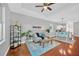 Inviting living room featuring hardwood floors, comfortable seating, and stylish decor at 3002 E 24Th Ave, Tampa, FL 33605