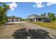 Beautiful home featuring a 3-car garage, neutral paint and a long driveway at 30229 Coast Ln, Wesley Chapel, FL 33545
