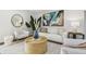 Bright living room featuring modern decor, comfortable seating, and stylish accents at 30229 Coast Ln, Wesley Chapel, FL 33545