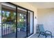 Enjoy relaxing on this balcony, accessible through sliding glass doors, providing natural light at 3166 Lake Pine S Way # E3, Tarpon Springs, FL 34688
