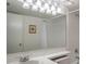 Bright bathroom features a large mirror, updated vanity, and shower with white subway tile surround at 3166 Lake Pine S Way # E3, Tarpon Springs, FL 34688