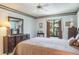 Bright bedroom with large window, dresser, and tasteful decor, creating a comfortable and inviting atmosphere at 3166 Lake Pine S Way # E3, Tarpon Springs, FL 34688