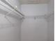 Spacious walk-in closet with multiple shelving units providing organized storage space for clothes and accessories at 3166 Lake Pine S Way # E3, Tarpon Springs, FL 34688