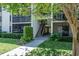 Condo complex walkway up to the units with landscaping and shady trees at 3166 Lake Pine S Way # E3, Tarpon Springs, FL 34688