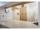 Kitchen counter view that shows a clock on the wall, wooden cabinets, and an attached white refrigerator at 3166 Lake Pine S Way # E3, Tarpon Springs, FL 34688