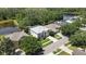 Aerial shot showcasing a screened-in pool and lush landscape backing to the pond at 3243 Ashmonte Dr, Land O Lakes, FL 34638