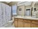 Bathroom featuring a shower with a dragonfly curtain and a window at 3243 Ashmonte Dr, Land O Lakes, FL 34638