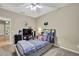 Bedroom with carpet, neutral walls, ceiling fan, and a window at 3243 Ashmonte Dr, Land O Lakes, FL 34638
