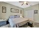 Bedroom featuring a ceiling fan, carpet, and neutral wall color at 3243 Ashmonte Dr, Land O Lakes, FL 34638