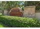 Community sign, Ashmonte, with stone accents and mature landscaping at 3243 Ashmonte Dr, Land O Lakes, FL 34638