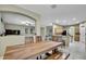 Dining room featuring wood table, chairs, and an open concept layout at 3243 Ashmonte Dr, Land O Lakes, FL 34638