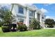 Two-story home with lush landscaping and a manicured lawn showcasing curb appeal at 3243 Ashmonte Dr, Land O Lakes, FL 34638