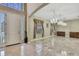 Grand foyer with marble floors, chandelier and high ceilings at 3243 Ashmonte Dr, Land O Lakes, FL 34638