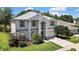 Well-manicured lawn and landscaping accent this lovely two-story home with an attached garage at 3243 Ashmonte Dr, Land O Lakes, FL 34638