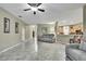 Open concept living space with marble floors, neutral colors, and modern furniture at 3243 Ashmonte Dr, Land O Lakes, FL 34638