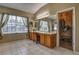 This sun-filled main bathroom features a double vanity, and a walk-in closet at 3243 Ashmonte Dr, Land O Lakes, FL 34638