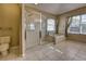 The bathroom includes a glass enclosed shower, soaking tub, and classic toilet at 3243 Ashmonte Dr, Land O Lakes, FL 34638