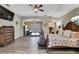 This spacious main bedroom features wood-look floors, a ceiling fan and a walk-in closet at 3243 Ashmonte Dr, Land O Lakes, FL 34638