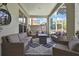 Relax on this comfortable outdoor patio with wicker furniture, area rug, and a view of the pool at 3243 Ashmonte Dr, Land O Lakes, FL 34638