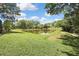 Beautiful pond surrounded by lush greenery, creating a serene and picturesque outdoor space at 3243 Ashmonte Dr, Land O Lakes, FL 34638