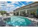 Enjoy the pool and spa with fountain features, set within a screened enclosure and overlooking the patio at 3243 Ashmonte Dr, Land O Lakes, FL 34638