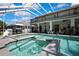 Enjoy this pool and spa area complete with statues, grill, gazebo, and a covered patio at 3243 Ashmonte Dr, Land O Lakes, FL 34638