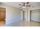 Spacious bedroom features tile floors, a ceiling fan, and closet at 3262 Montclair Cir, North Port, FL 34287