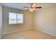 Well-lit bedroom features tile floors, a ceiling fan, and window view at 3262 Montclair Cir, North Port, FL 34287