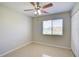 Comfortable bedroom with tile floors, a ceiling fan, and natural light at 3262 Montclair Cir, North Port, FL 34287