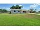 A charming single-story home with a well-maintained lawn and attached one car garage at 3262 Montclair Cir, North Port, FL 34287