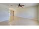 Open living room boasts tile floors and a back patio view at 3262 Montclair Cir, North Port, FL 34287