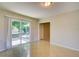 Bright living room features tile floors and sliding glass doors at 3262 Montclair Cir, North Port, FL 34287